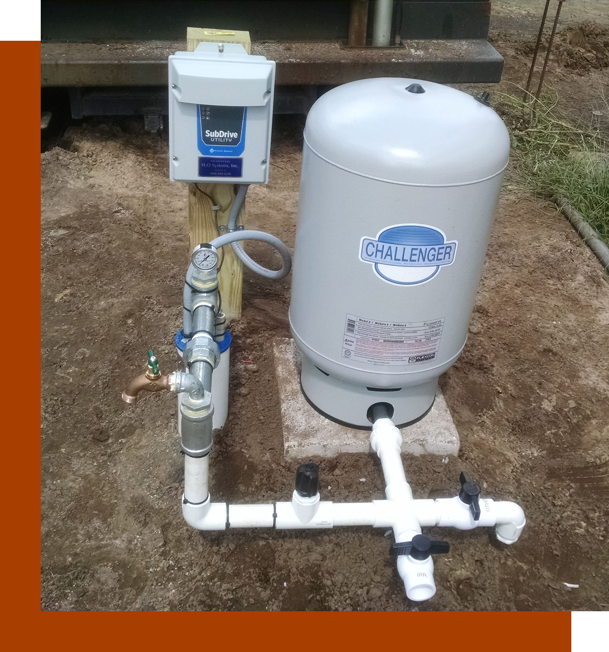Group 78 A water heater and pump in the dirt.