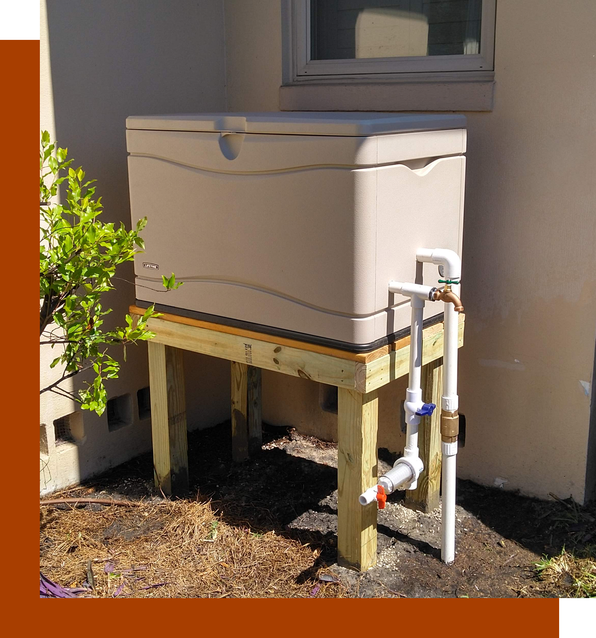 Group 80 A white cooler sitting on top of a wooden stand.