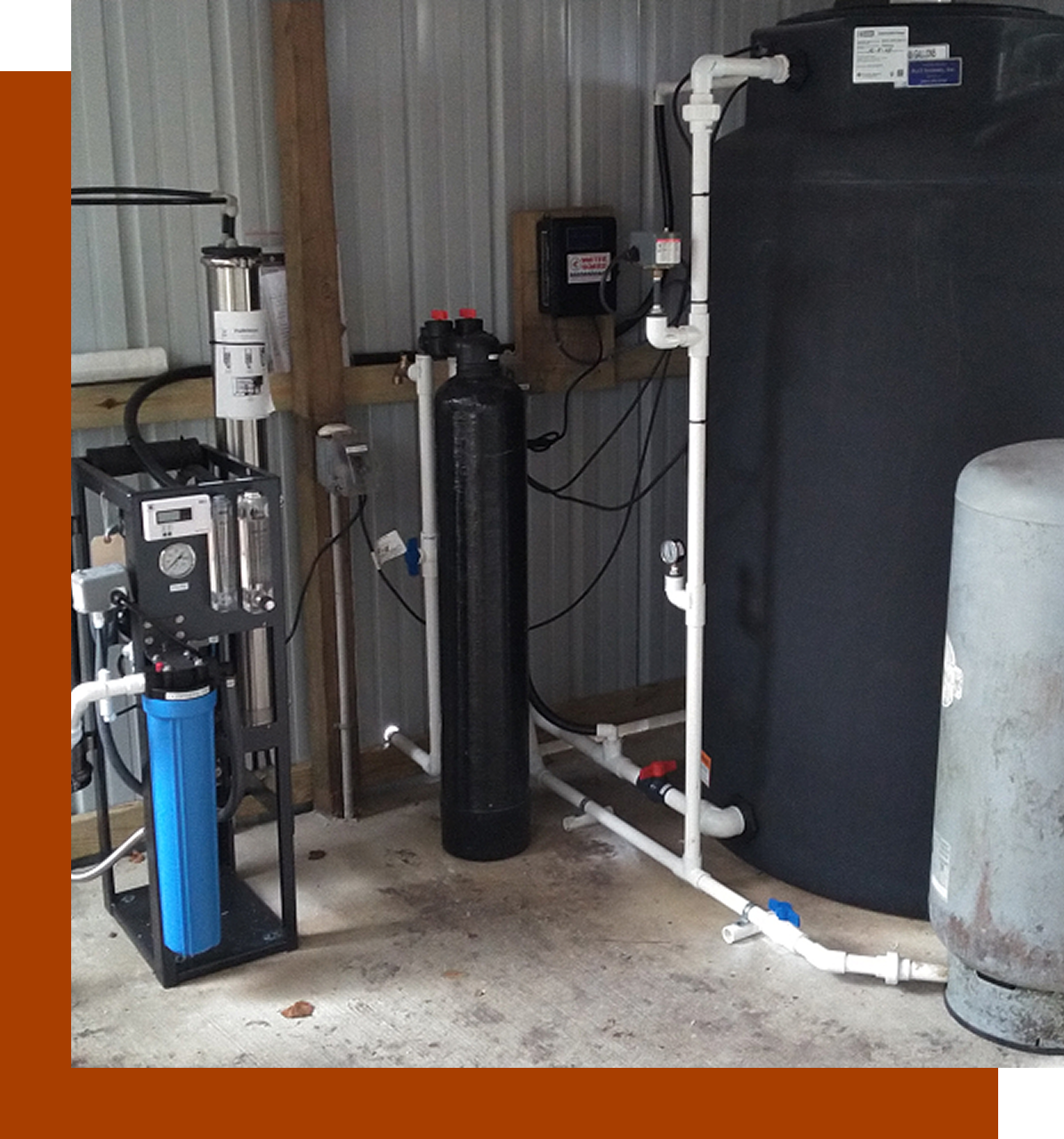 A water treatment system in the middle of an industrial setting.