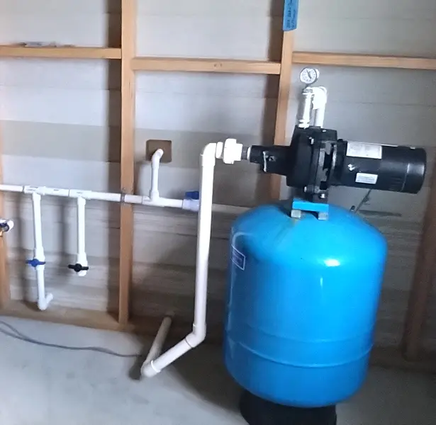 image 2 A blue tank sitting in the middle of a room.