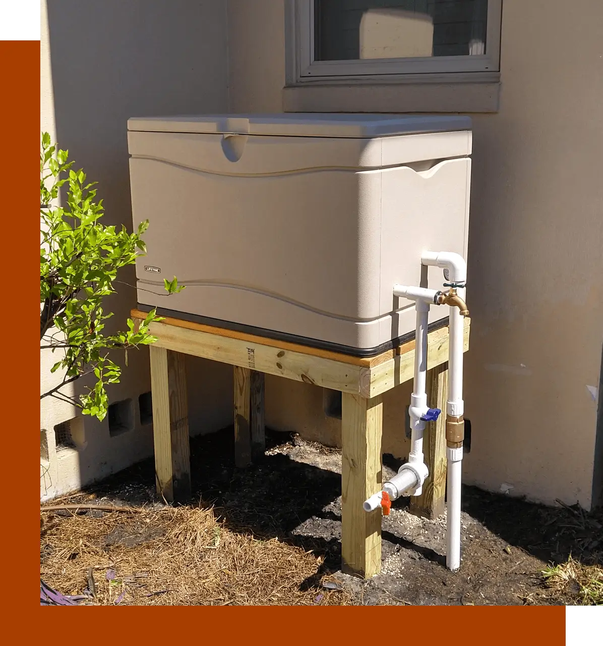 A white cooler sitting on top of a wooden stand.