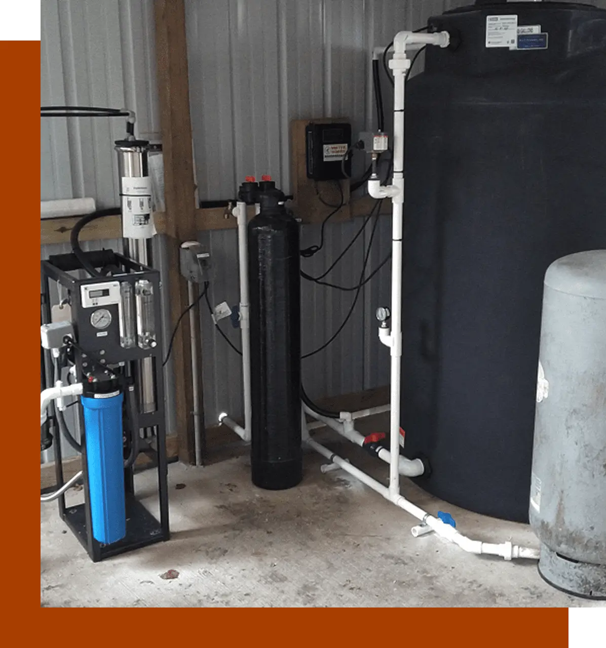 A water treatment system in the middle of an industrial setting.
